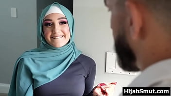 Teenage Muslim dame receives training from her soccer coach