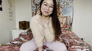 A super-cute Asian lass with glasses eagerly creates a solo movie for us